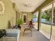 Relaxing screened lanai with comfortable seating and a view of the backyard at 3721 Adelaide Ave, North Port, FL 34288