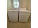 Modern washer and dryer set with window view at 3721 Adelaide Ave, North Port, FL 34288