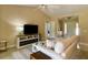 Inviting living area featuring a modern entertainment center and comfortable sofa at 3721 Adelaide Ave, North Port, FL 34288
