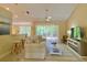 Inviting living room with a comfortable sofa and sliding doors leading to the backyard at 3721 Adelaide Ave, North Port, FL 34288