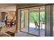 Relaxing patio with furniture, visible through sliding glass doors at 3721 Adelaide Ave, North Port, FL 34288