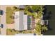 Aerial shot displays a screened-in pool, private boat dock, and canal-front living at 441 Norma Ct, Punta Gorda, FL 33950