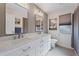 Bright bathroom featuring a large vanity with double sinks and modern fixtures at 441 Norma Ct, Punta Gorda, FL 33950