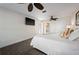 Inviting bedroom featuring gray floor tile and a mounted television for entertainment at 441 Norma Ct, Punta Gorda, FL 33950