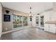 Bright dining area with tile flooring, backyard views and a stylish chandelier at 441 Norma Ct, Punta Gorda, FL 33950