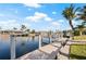 Dock on canal with boat lift, providing easy access to waterways and boating adventures at 441 Norma Ct, Punta Gorda, FL 33950