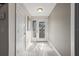 Bright foyer featuring stylish tile flooring, decorative glass front door, and neutral color palette at 441 Norma Ct, Punta Gorda, FL 33950
