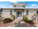 Charming home featuring a well-maintained front yard and a welcoming entrance with lush landscaping at 441 Norma Ct, Punta Gorda, FL 33950
