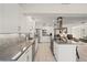 Well-lit kitchen featuring white cabinetry, stainless steel appliances, and an open concept layout at 441 Norma Ct, Punta Gorda, FL 33950
