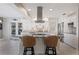 Contemporary kitchen featuring a large island, stainless steel appliances, and stylish bar stool seating at 441 Norma Ct, Punta Gorda, FL 33950