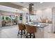 Modern kitchen with an island, stainless steel appliances, and a sleek vent hood at 441 Norma Ct, Punta Gorda, FL 33950