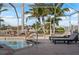Relaxing screened-in pool setting with waterfront views, lounge seating, and a secure railing for easy pool access at 441 Norma Ct, Punta Gorda, FL 33950