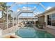 Relaxing enclosed pool setting with clear water, stylish planters, and comfortable lounge chairs for outdoor enjoyment at 441 Norma Ct, Punta Gorda, FL 33950