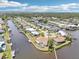 Waterfront community with canals and docks for boating, surrounded by tropical foliage and landscaping at 5194 Cooper Ter, Port Charlotte, FL 33981