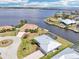 An aerial view of a waterfront community with canals, homes and boat docks at 5194 Cooper Ter, Port Charlotte, FL 33981