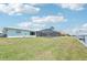 Rear exterior showing the screened pool and waterfront access at 5194 Cooper Ter, Port Charlotte, FL 33981