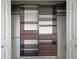 Spacious closet with built-in shelving, drawers, and rods for optimal organization and storage at 5194 Cooper Ter, Port Charlotte, FL 33981