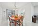 View of dining area with a chandelier and a view to the lanai and pool at 5194 Cooper Ter, Port Charlotte, FL 33981