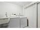 Functional laundry room equipped with a washer, dryer, and utility sink for added convenience at 5194 Cooper Ter, Port Charlotte, FL 33981