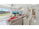 Cozy living room with comfortable seating, ceiling fan and bright windows overlooking the canal at 5194 Cooper Ter, Port Charlotte, FL 33981