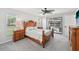 Comfortable bedroom with a beautiful view of the pool area through sliding glass doors at 5194 Cooper Ter, Port Charlotte, FL 33981