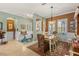 Elegant dining room with stylish decor, a chandelier, and a view into the entryway at 5428 Royal Poinciana Way, North Port, FL 34291