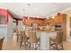 Spacious kitchen features a large island, stainless steel appliances, and ample cabinet space at 5428 Royal Poinciana Way, North Port, FL 34291