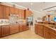 Kitchen features stainless steel appliances, granite countertops, and a decorative backsplash at 5428 Royal Poinciana Way, North Port, FL 34291