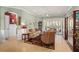 Cozy living room with neutral tones, comfortable seating, and an open layout at 5428 Royal Poinciana Way, North Port, FL 34291