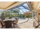 Inviting outdoor screened-in pool and spa area, perfect for entertaining guests at 5428 Royal Poinciana Way, North Port, FL 34291