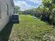 Generous backyard offering plenty of space, a lush lawn, and the potential for various outdoor activities at 705 Crestview Nw Cir, Port Charlotte, FL 33948
