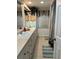 Spacious bathroom featuring dual sinks, long vanity, and separate shower with striped curtain at 705 Crestview Nw Cir, Port Charlotte, FL 33948