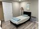 Comfortable bedroom with modern floors, a closet, and a comfortable bed with gray and white patterned comforter at 705 Crestview Nw Cir, Port Charlotte, FL 33948