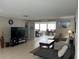 Spacious living room with tile flooring and a large window providing natural light at 705 Crestview Nw Cir, Port Charlotte, FL 33948