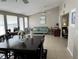 Open floor plan featuring a living and dining area with bright lighting and neutral decor at 705 Crestview Nw Cir, Port Charlotte, FL 33948