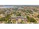 Overhead shot of a residential area with well-maintained homes and verdant trees, close to a scenic lake and commercial area at 7434 Ashtabula St, Englewood, FL 34224