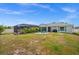 Large backyard with pool, lounging area and ample room for outdoor activities at 7434 Ashtabula St, Englewood, FL 34224