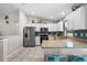 Well-lit kitchen with stainless steel appliances, granite countertops, and blue backsplash at 7434 Ashtabula St, Englewood, FL 34224