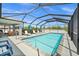 Lovely screened-in pool area with ample seating for entertaining and enjoying the outdoors at 7434 Ashtabula St, Englewood, FL 34224