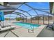 Screened pool area with loungers offers a relaxing backyard retreat at 7434 Ashtabula St, Englewood, FL 34224