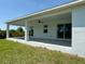 Spacious outdoor patio perfect for entertaining and relaxation with plenty of space to enjoy the backyard at 7474 Manville Ter, Port Charlotte, FL 33981