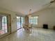 Bright dining room with pool views, and a glass top table with four wicker chairs at 1305 Alton Rd, Port Charlotte, FL 33952
