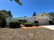 Attractive home featuring a gated front entrance, attached garage, and a lovely brick walkway at 1305 Alton Rd, Port Charlotte, FL 33952