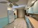 Spacious kitchen area with light-colored cabinets and updated appliances at 1305 Alton Rd, Port Charlotte, FL 33952