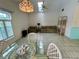 Well-lit living room showcasing tile floors and a comfortable seating area, with shelving at 1305 Alton Rd, Port Charlotte, FL 33952