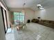 Inviting living room with lots of natural light and comfortable seating, near a sliding door at 1305 Alton Rd, Port Charlotte, FL 33952