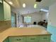A comfortable living room and breakfast nook with access to the kitchen and a view to the pool at 1305 Alton Rd, Port Charlotte, FL 33952