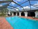 Screened-in pool with ample brick patio area and access to the main house at 1305 Alton Rd, Port Charlotte, FL 33952