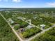 A high aerial view of this quiet neighborhood with lush landscaping at 13235 Essman Ave, Port Charlotte, FL 33953