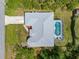 See the screened-in pool with an aerial view of the house at 13235 Essman Ave, Port Charlotte, FL 33953